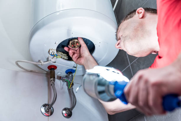 "dubai-plumber-doing-repair-work-for-residential-water-heater"